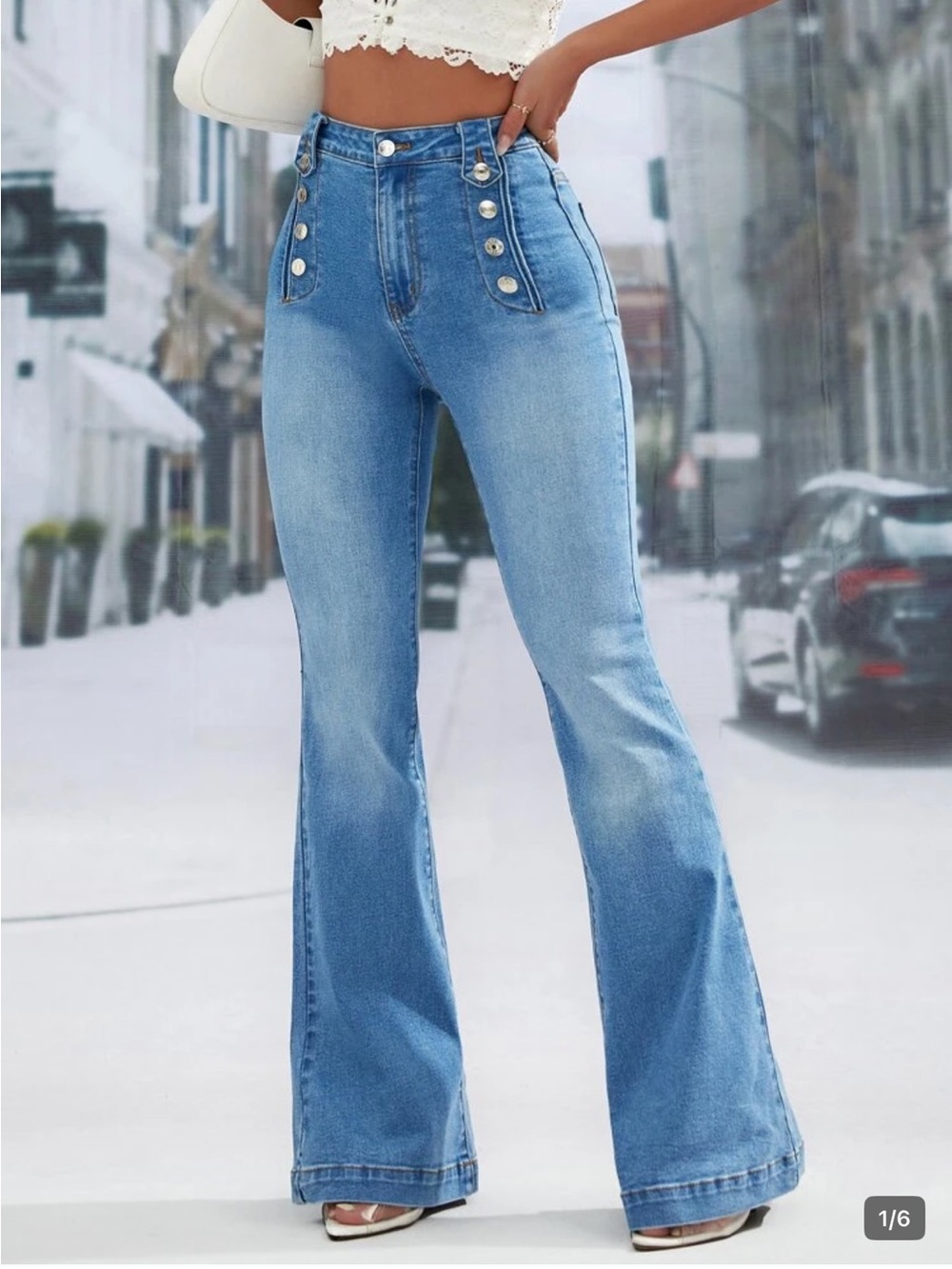 High-Waist Light Blue Flare Jeans with Button Detail
